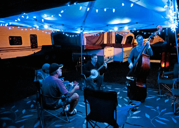Musicians playing at night in the campgrounds
