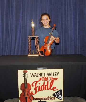 3rd Place Fiddle Winner, Maria McArthur with trophy and prize fiddle