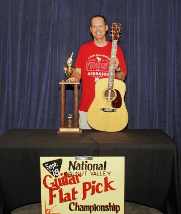 2nd Place Flat Pick Guitar Winner, Jason Shaw, with Trophy and Prize Guitar