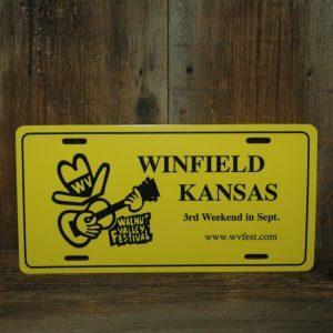 Yellow Car Tag, reads "Winfield, Kansas, 3rd Weekend in Sept., www.wvfest.com"