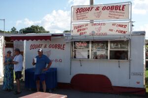 Squat & Gobble's smoked meats for sale on the festival midway