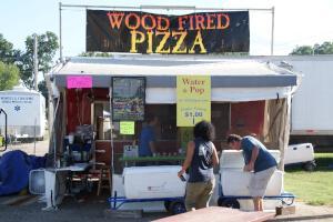 Wood fired pizza for sale on the festival midway