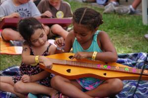 Kids learning new instruments at Feisty's Kids Music Camp