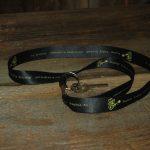 Black lanyard with Feisty, reads "Walnut Valley Festival, 3rd Weekend in September, Winfield, KS"