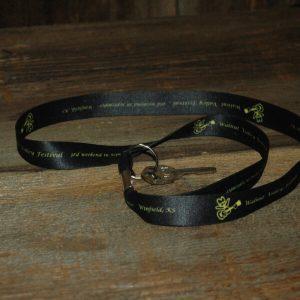 Black lanyard with Feisty, reads "Walnut Valley Festival, 3rd Weekend in September, Winfield, KS"