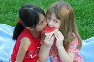 Girls sharing watermelon