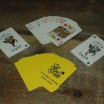 Yellow Playing Cards with Fesity, reads "Walnut Valley Festival, 3rd Weekend in September, Winfield, Kansas"