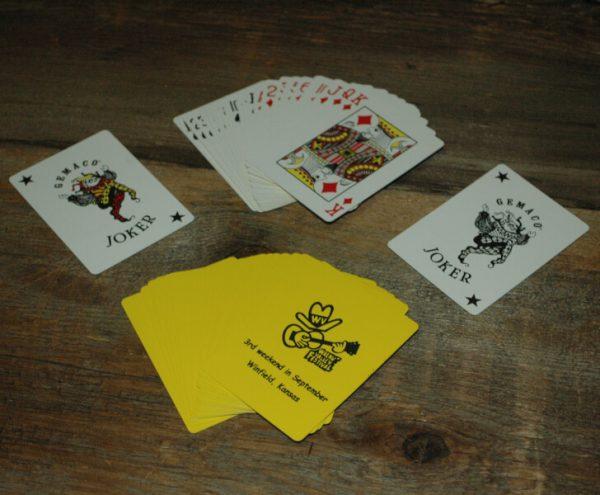 Yellow Playing Cards with Fesity, reads "Walnut Valley Festival, 3rd Weekend in September, Winfield, Kansas"